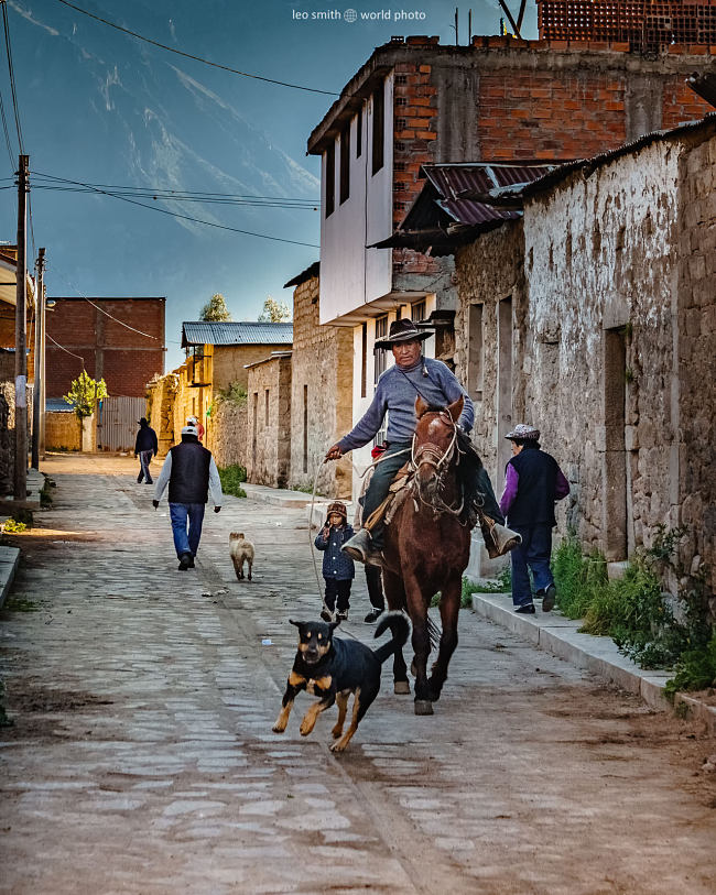 Leo Smith World Photo: Peru Photos and Prints - A man rides a horse while walking his dog, Cabanaconde, Peru