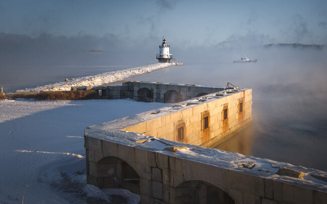 Spring Point Light, South Portland Maine, during coldest day of year with sea smoke and tug boat - Leo Smith Photo Video